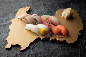 a piece of paper with some vegetables on it at HOTEL VISCHIO TOYAMA in Toyama