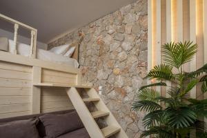 Ένα ή περισσότερα κρεβάτια σε δωμάτιο στο Casa Sym Faliraki