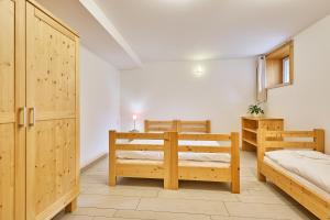 Postel nebo postele na pokoji v ubytování Snezka Residence