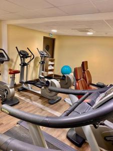 a gym with a bunch of cardio equipment in a room at Studio résidence touristique 3 étoiles in Le Mée-sur-Seine