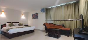 Postel nebo postele na pokoji v ubytování Wayanad Kuruva Isles Jungle Resort