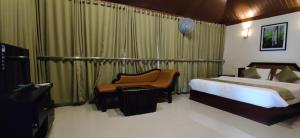 Postel nebo postele na pokoji v ubytování Wayanad Kuruva Isles Jungle Resort