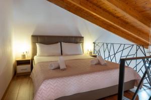 Postel nebo postele na pokoji v ubytování Atlantis Hotel & Apartments