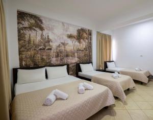 Postel nebo postele na pokoji v ubytování Atlantis Hotel & Apartments
