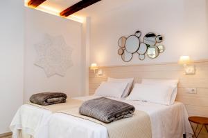 Casa Del Patio - Boutique Apartments客房内的一张或多张床位