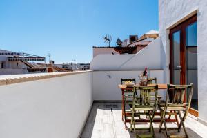 Casa Del Patio - Boutique Apartments的阳台或露台