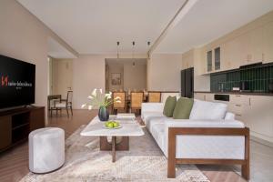 TV a/nebo společenská místnost v ubytování Epic Tower Swiss-Belresidences Hanoi