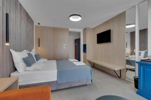 Posteľ alebo postele v izbe v ubytovaní Hotel Laurentum