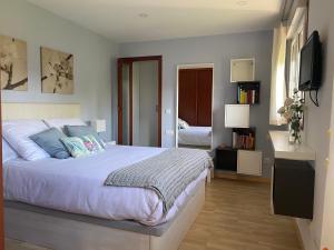 Katil atau katil-katil dalam bilik di Loft Playa Rodeira