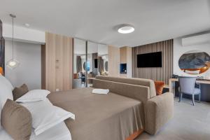 Televízia a/alebo spoločenská miestnosť v ubytovaní Hotel Laurentum