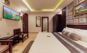 Postel nebo postele na pokoji v ubytování Empress Dalat - Sky View Hotel