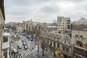 a view of a city street with cars and buildings at Dreamy City Center in Bucharest