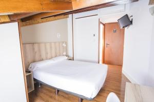 Cama o camas de una habitación en Hotel Alda Avenida