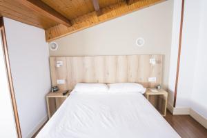 Cama o camas de una habitación en Hotel Alda Avenida