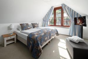 Rúm í herbergi á Kleinhuis Hotel Mellingburger Schleuse