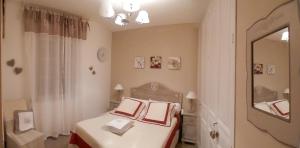 a bedroom with a bed with a mirror at mas la Mouillere in Camélas