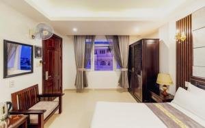 Postel nebo postele na pokoji v ubytování Empress Dalat - Sky View Hotel