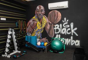 a gym with a basketball player painted on the wall at Rise Urban Art Hotel in Larnaca
