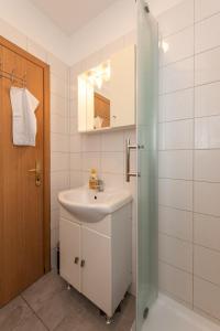 Kúpeľňa v ubytovaní Laghanini Apartments
