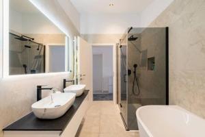 a white bathroom with two sinks and a shower at Villa La Domazet in Podstrana +41 photos