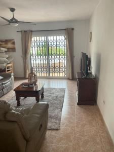 a living room with a couch and a table at Casa Verano in Alicante