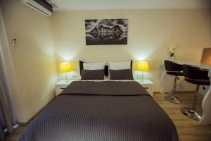 Postel nebo postele na pokoji v ubytování Aparthotel Holiday Lux Batumi
