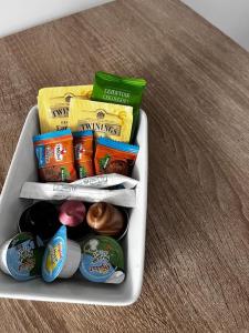 a container filled with different types of food on a table at Logement proche gare et Versailles in Marly-le-Roi +6 photos