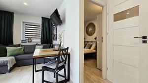 Posteľ alebo postele v izbe v ubytovaní Apartament Słoneczne Okno