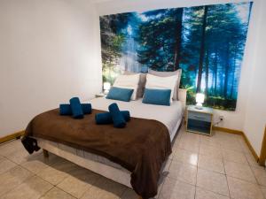 Ένα ή περισσότερα κρεβάτια σε δωμάτιο στο L'Eden, studio loft zen