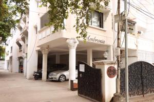 a car parked in front of a building at Greams Road Near Apollo Deluxe Fusion Serviced Apartments in Chennai
