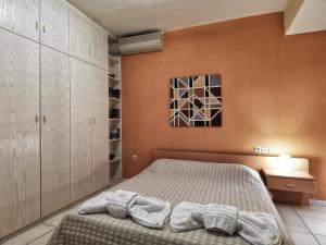 Postel nebo postele na pokoji v ubytování Elia Apartments