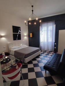 A bed or beds in a room at Manì Rooms