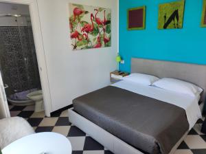 A bed or beds in a room at Manì Rooms