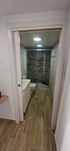 a bathroom with a tub and a sink and a toilet at Vitarka, ático del mar in Torre del Mar +26 photos