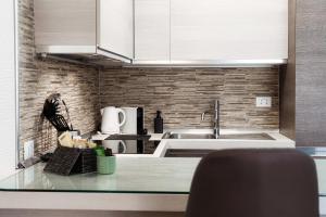 A kitchen or kitchenette at Terrazza Paradiso 2 by Quokka 360 - Studio with Balcony