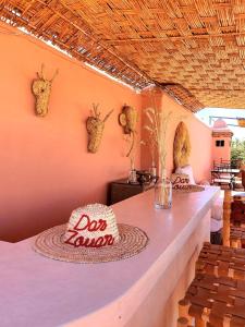 a room with a table and chairs and a tableablish at Riad Dar Zouar & Spa in Marrakech