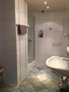 a bathroom with a tub and a sink and a shower at Ohmayerhof in Isny im Allgäu