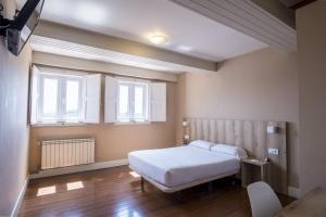 Cama o camas de una habitación en Hotel Alda Avenida