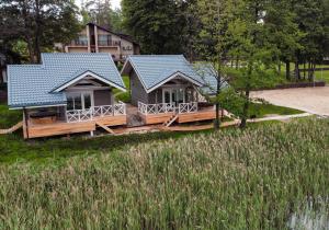 an aerial view of two cottages in a park at Vila Ula in Perloja