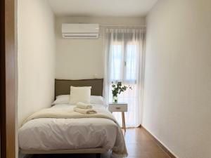 Postel nebo postele na pokoji v ubytování FuensalidaHomes101