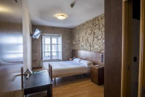 Cama o camas de una habitación en Hotel Alda Avenida