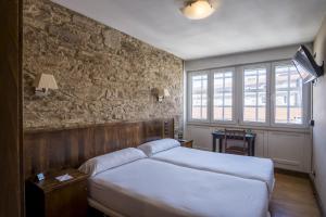 Cama o camas de una habitación en Hotel Alda Avenida