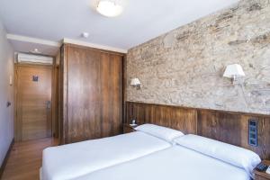 Cama o camas de una habitación en Hotel Alda Avenida