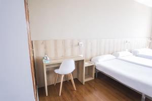 Cama o camas de una habitación en Hotel Alda Avenida