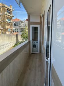 a washer and dryer on a balcony of a house at Gaviota 2do in Marín