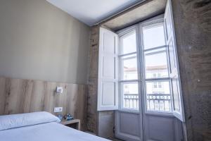 Cama o camas de una habitación en Hotel Alda Avenida