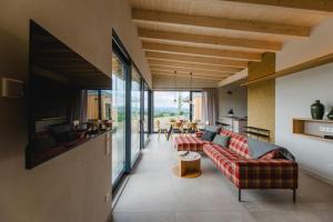 a living room with a couch and a table at Birkenhof - Ferienhof, Landcafe und Rösterei in Schmallenberg