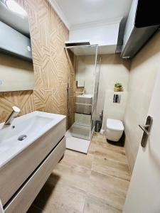 a bathroom with a sink and a toilet at Maison Miramar Cabo Cervera in Torrevieja +29 photos