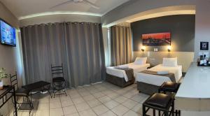Postel nebo postele na pokoji v ubytování N1 Hotel Bulawayo