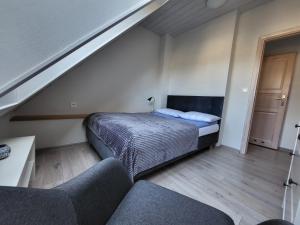 Postel nebo postele na pokoji v ubytování Gryf-Balt - Apartament